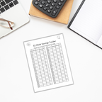 An overhead view of a desk featuring The 100 Envelope Challenge tracker templates notebook, glasses, and a calculator—all set for tackling the 52-week savings challenge.