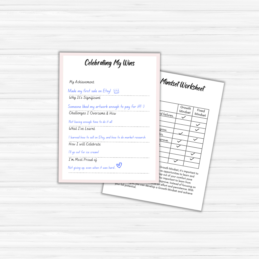 On a light wood surface, two "The Glow Getter" worksheets are displayed. On the left, a "Celebrating My Wins" worksheet highlights handwritten achievements that embody the spirit of a true glow getter. On the right, a "Mindset Worksheet" features a grid comparing fixed and growth mindsets, ideal for anyone excelling in their personal development journey.