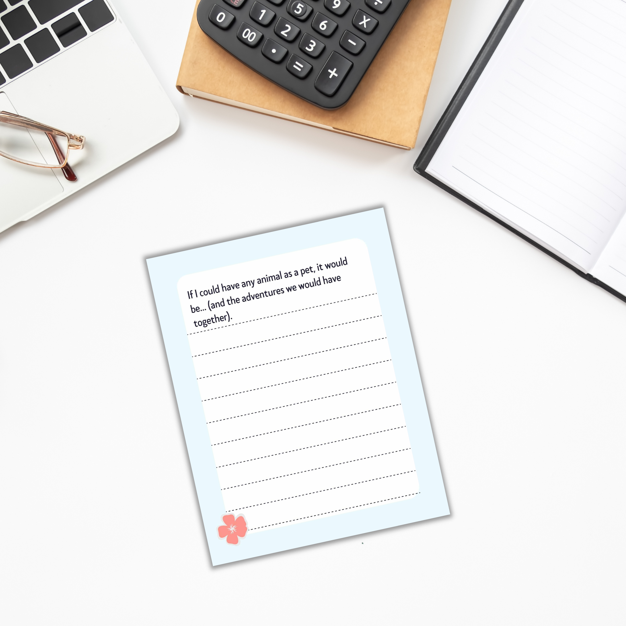 A page from the *Summer Journal for Kids*, featuring the prompt "If I could have any animal as a pet, it would be… (and the adventures we would have together)," lies next to a laptop, calculator, and glasses on the desk—an ideal inspiration for imaginative tales and whimsical summer narratives.