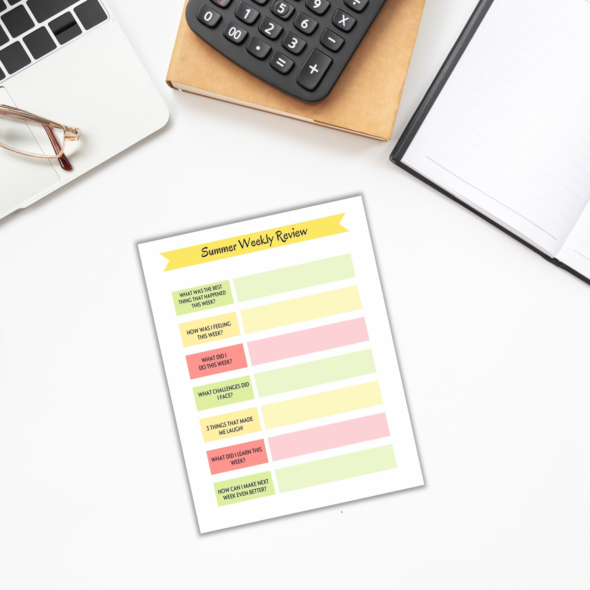 An overhead view of a desk displays a laptop, calculator, glasses, and notebook. The "Summer Planner for Kids" features a "Summer Weekly Review" sheet filled with prompts that embody the spirit of organizing children's activities and more.