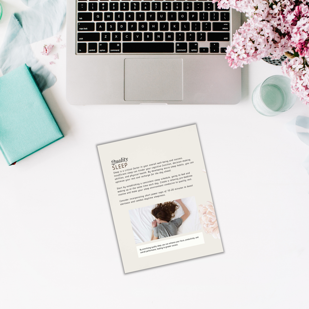 A laptop, flowers, and a turquoise notebook rest on a white surface, accompanied by an ebook titled "Powerful Micro Habits - Ebook & Workbook," featuring cover art of someone sleeping and text related to sleep habits.