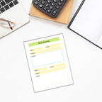 Flat lay of a Summer Reading Planner for Kids sheet on a desk with glasses, a calculator, a notebook, and a box—ideal for organizing your children's summer reading list.